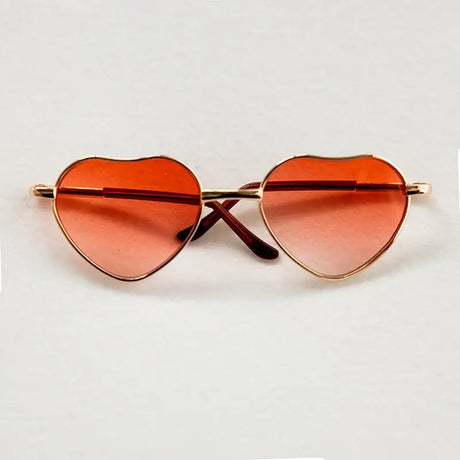 Newborn heart-shaped sunglasses in orange for baby photography, unisex design, perfect accessory for adorable baby photo shoots.