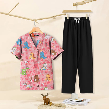 Cartoon print dental scrubs set featuring a pink top with playful characters and black pants, perfect for pet grooming and beauty salons.