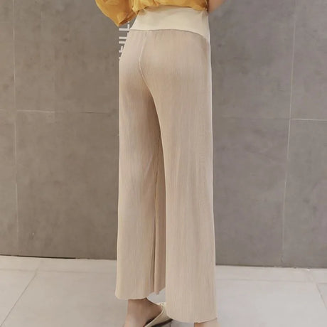 Breathable adjustable waist maternity pants in beige, featuring a loose fit and wide leg design, perfect for summer wear.