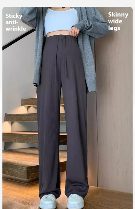 Wide-leg maternity pants with drawstring, featuring a stylish design and comfortable fit.