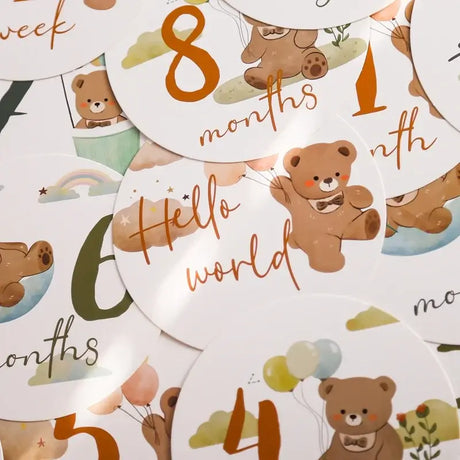 Colorful baby milestone cards featuring adorable bear patterns, 16-piece set for ages 0-12 months, perfect for photo shoots.