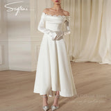 Chic off shoulder satin wedding dress with detachable sleeves, ankle-length and elegant draped design.