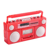 Red vintage-style boombox radio with adjustable knobs and speakers, perfect for retro-themed photography props.