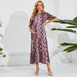 Elegant beach maternity dress with geometric pattern, perfect for summer photoshoots and stylish comfort for expectant mothers.