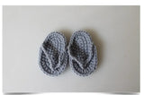 Soft gray crocheted baby flip flops, perfect for infant wear, designed for comfort and style, suitable for new parents.