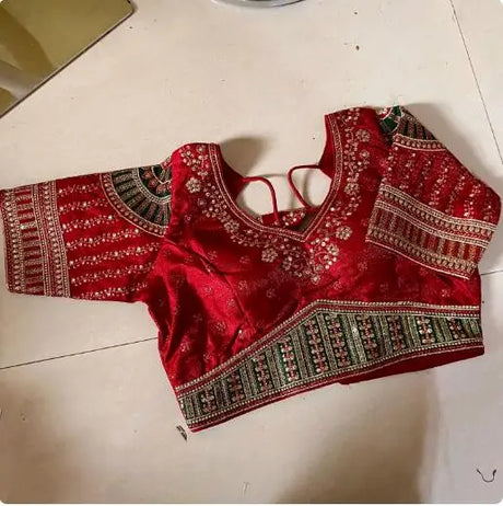 Red embroidered India sari top with intricate patterns, perfect for women's traditional ethnic wear.