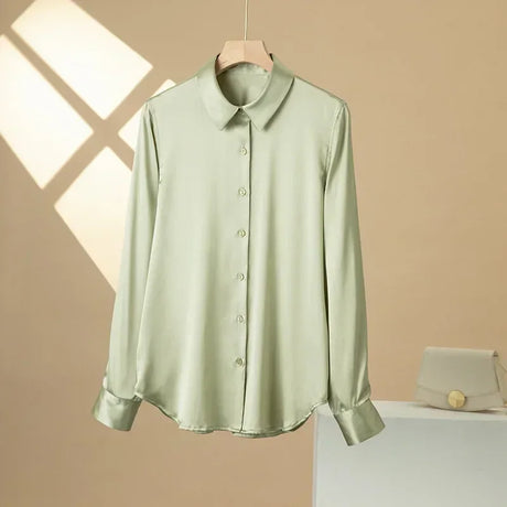 SatinGrace™ long sleeve silk shirt in soft green, featuring a V-neck and button closure for women.