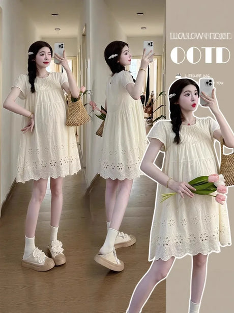 Woman wearing a knee-length A-line cotton maternity dress in a light color, showcasing a casual summer style.