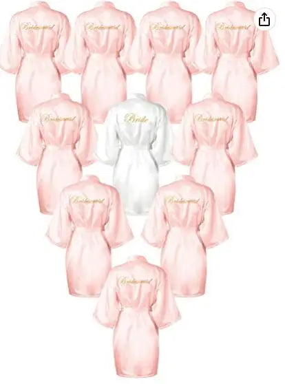 Collection of rose gold and white satin bride robes featuring elegant lettering for bridal parties.