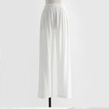 White elastic waist wide-leg pants for men and women, made from lightweight polyester material.