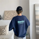 Oversized Harajuku streetwear tee in navy with 'Newtro' design, showcasing a loose fit and casual style.