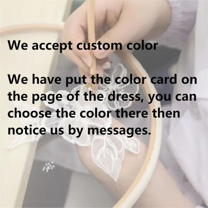 Craftsperson customizing color options for a wedding dress, demonstrating personalized tailoring services.