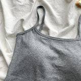CottoForm™ padded cotton camisole in gray color, featuring a slim fit and summer sleeveless design on a soft fabric backdrop.