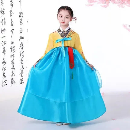 Korean Palace Hanbok for girls in vibrant yellow and blue, featuring traditional design and full-length skirt.