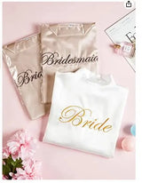 Bride and bridesmaid robes displayed on a pink background, featuring elegant script text.