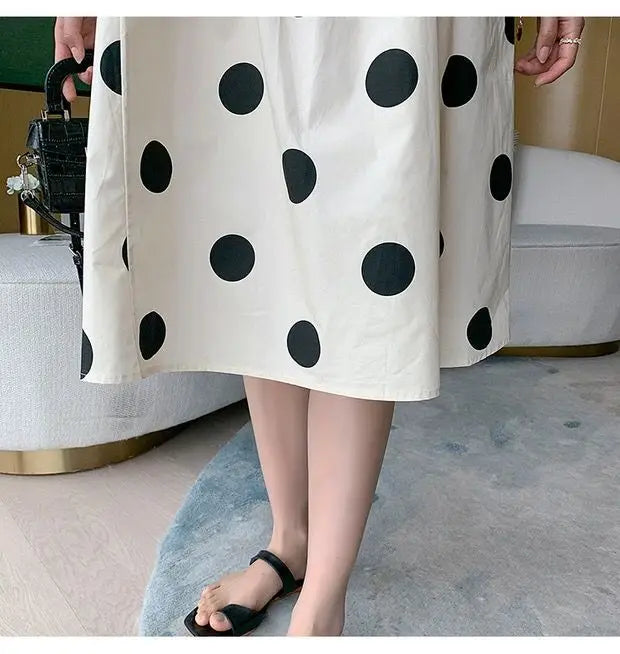 Polka dot loose maternity dress, mid-calf length, featuring a playful black polka dot pattern, perfect for summer outfits.
