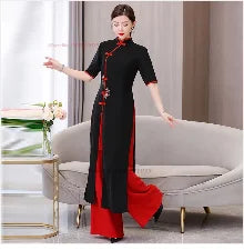 Woman in traditional black and red Hanbok dress, showcasing elegant design and cultural heritage.