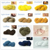 Colorful collection of baby blanket backdrops in various shades including yellow, green, brown, and blue, ideal for photo shoots.