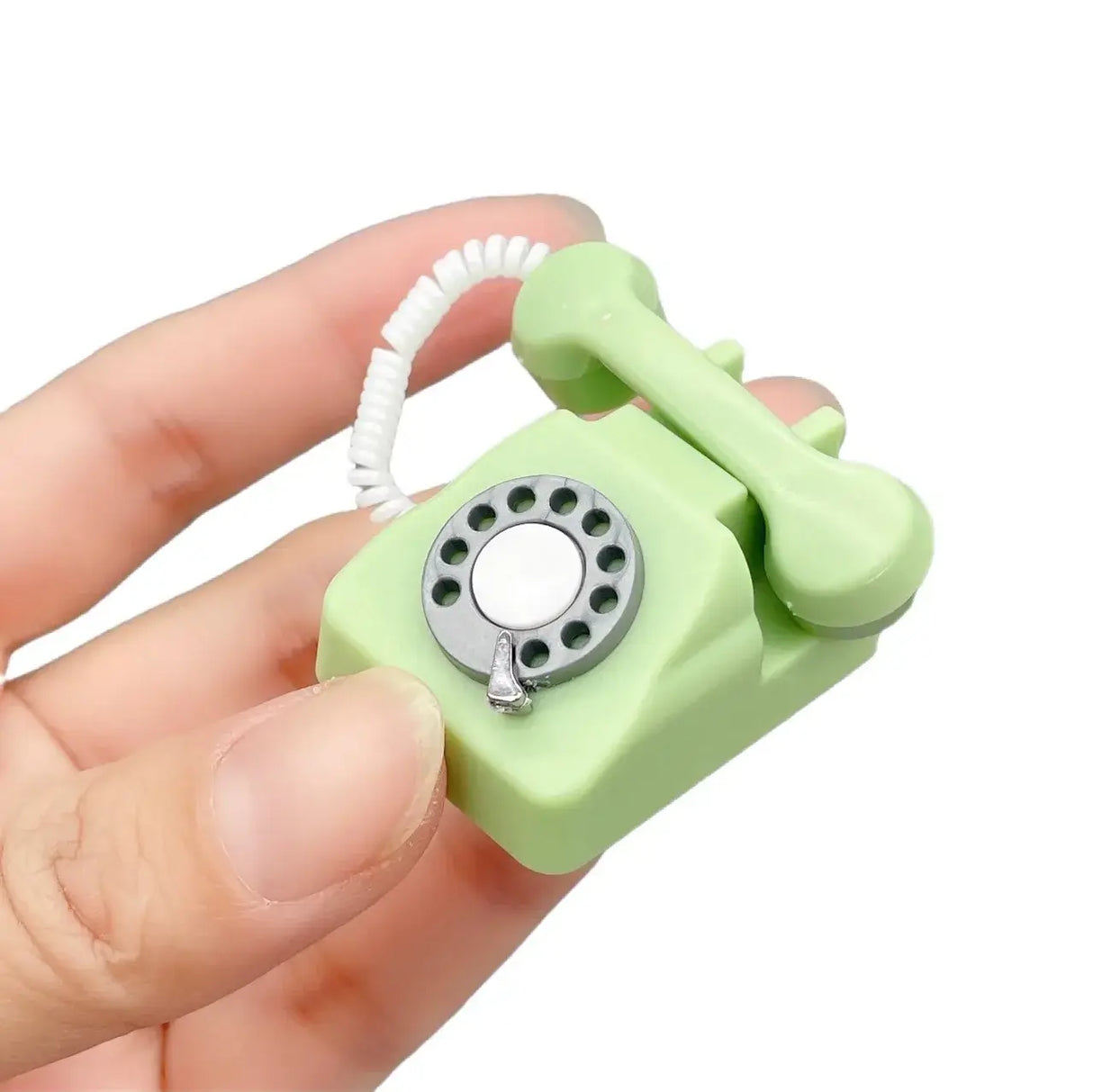 Mini vintage green telephone prop for newborn baby photography, designed for ages 0-3 months. Perfect accessory.