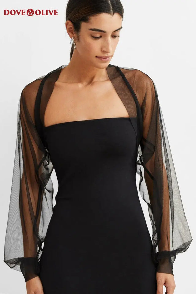 Black tulle bridal cape with long sleeves, perfect wedding jacket for brides, by Dove & Olive.
