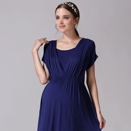 Model wearing a soft fabric nursing maternity dress in navy blue, featuring a comfortable design for postpartum use.