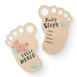 Baby milestone cards featuring feet design with 'Hello World' and 'Baby Steps' for newborn tracking.