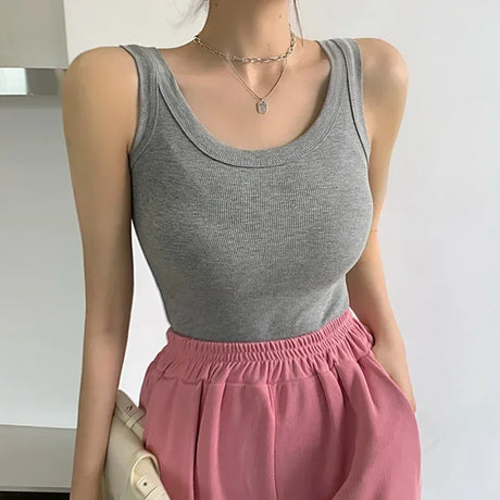 RetroRib™ 90s vintage sleeveless ribbed tank top in gray, styled with pink high-waisted pants, perfect for streetwear.