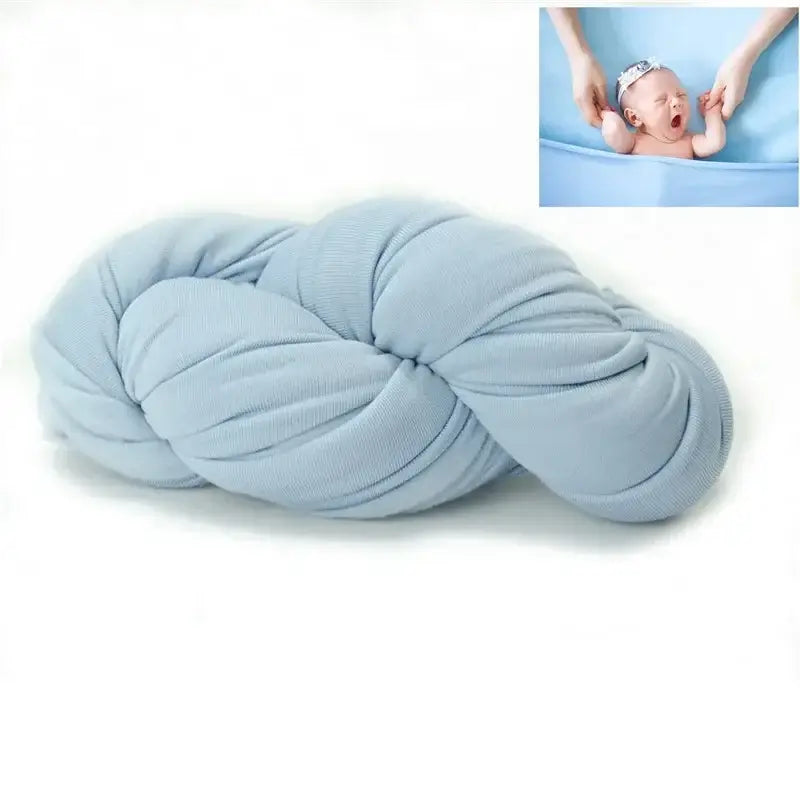 Cozy blue blanket designed as a photo shoot backdrop for newborns, made from soft polyester material.