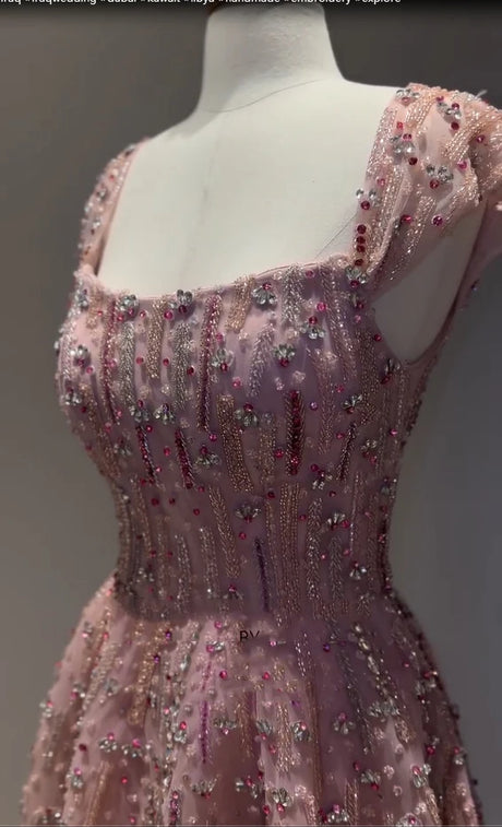 Glitter crystal mermaid wedding gown with beading and sequins, floor-length design, featured in pink.