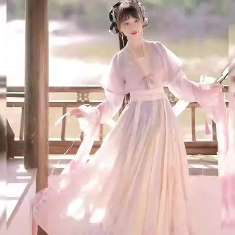 Woman wearing a beautiful Hanfu traditional dress with flowing ribbons, perfect for parties and festive occasions.