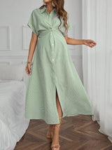 Woman in a striped short sleeve maternity dress, perfect for summer, showing off a casual and comfortable style.