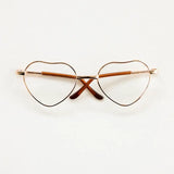 Heart-shaped baby glasses for newborn photography, colorful and unisex, perfect accessory for cute photo shoots.