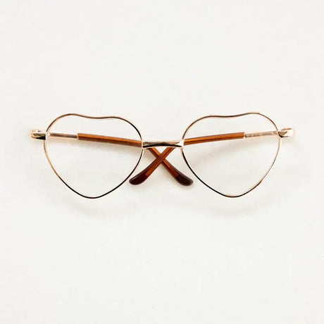 Heart-shaped baby glasses for newborn photography, colorful and unisex, perfect accessory for cute photo shoots.