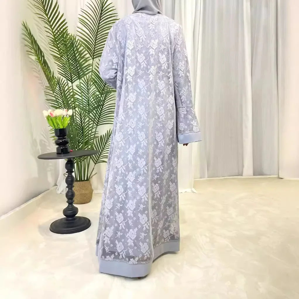Back view of a stylish Dubai Moroccan Kaftan in light gray, perfect for casual Islamic dress, showcasing floral patterns.
