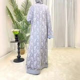 Back view of a stylish Dubai Moroccan Kaftan in light gray, perfect for casual Islamic dress, showcasing floral patterns.