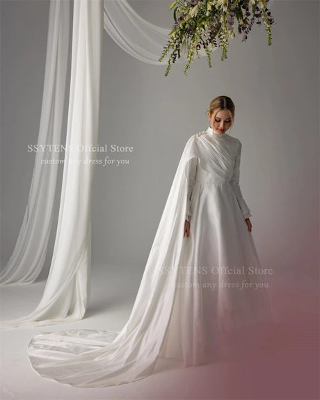 Elegant Muslim satin wedding dress featuring pearls, high neck, long sleeves, and a flowing train.