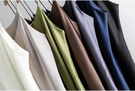 Assorted colors of BandeauSilk™ double-layer silk camisoles hanging, showcasing summer styles for women.