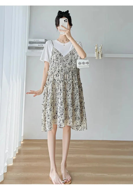 Elegant floral maternity dress in knee-length, featuring a boat neck and a cute silhouette, perfect for summer baby showers.