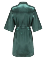Back view of a knee-length satin robe in deep green color with short sleeves and a tie belt.