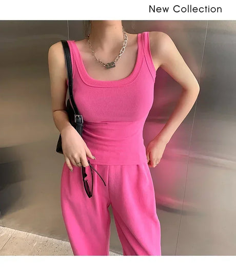 Model wearing RetroRib™ 90s vintage ribbed tank top in pink, styled with matching pants. Part of the new collection.