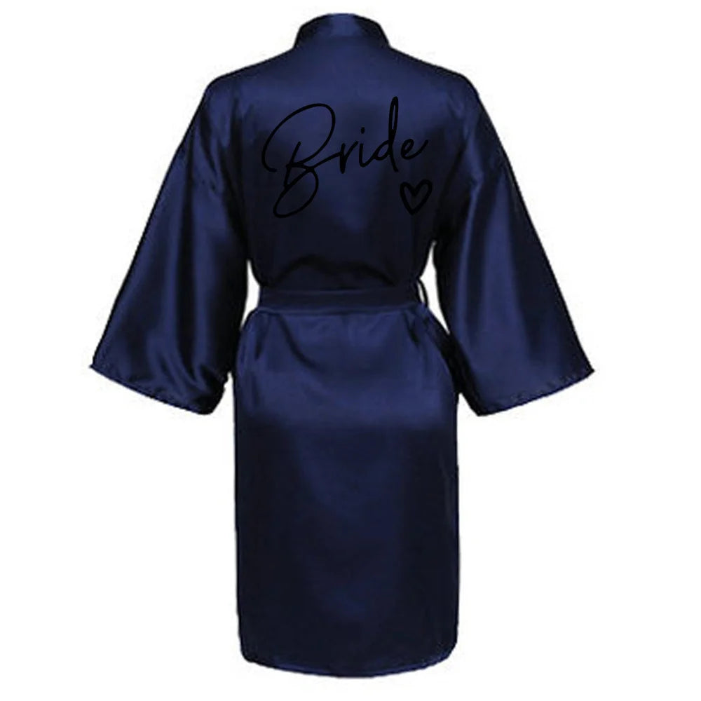 Navy satin robe for brides with a stylish 'Bride' print on the back, perfect for pre-wedding festivities.