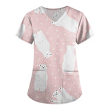 Cute pink polar bear print scrubs for women, perfect for veterinary nurses and medical professionals.