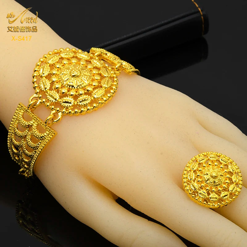 24K gold plated Indian bridal jewelry bracelet and ring set, adorned with intricate round patterns, perfect for weddings.