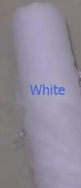 Close-up of a roll of white tulle fabric, ideal for bridal capes and elegant wedding details.