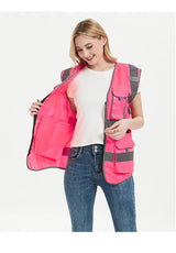 High visibility pink safety vest for women, featuring multiple pockets and reflective tape for enhanced visibility in work settings.