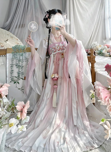 Elegant vintage Chinese style Hanfu dress in pink, designed for women, showcasing traditional fashion and floral details.