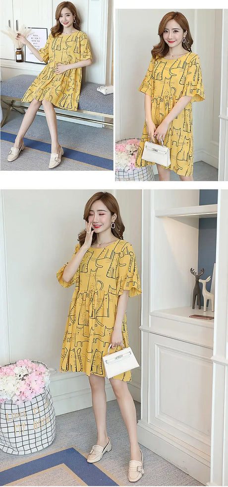 Loose Korean cartoon cat maternity dress in yellow with short sleeves and knee-length design, perfect for summer.