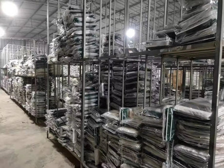 Warehouse storage filled with neatly packed Classic Tang Dynasty Hanfu robes on shelves, showcasing organized inventory.