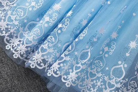 Knee-length blue summer dress for girls featuring a cartoon pattern with hearts and snowflakes, perfect for casual wear.