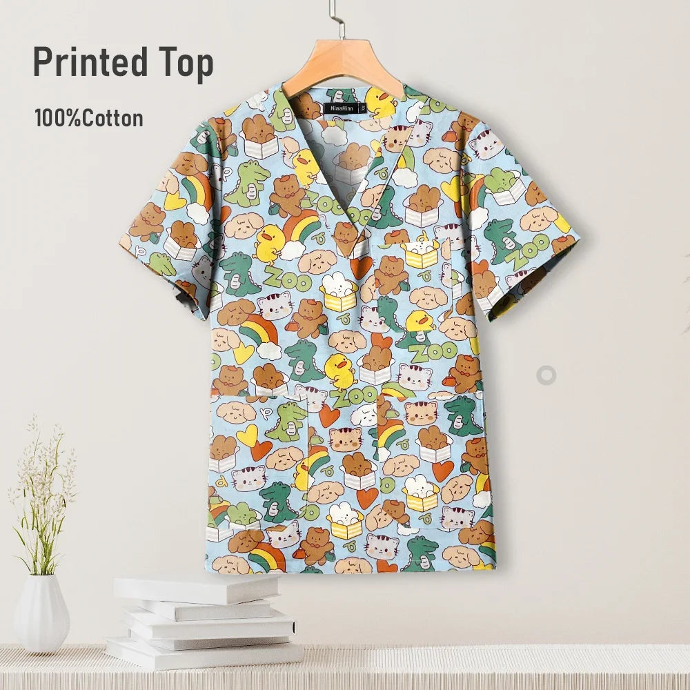 Colorful pediatric nursing scrub top in 100% cotton, featuring fun animal prints and a V-neck design.